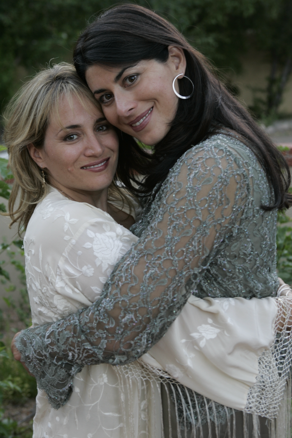 Two women embracing each other