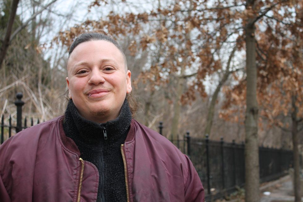 nonbinary chef Marino Benedetto wearing a bomber jacket outside.