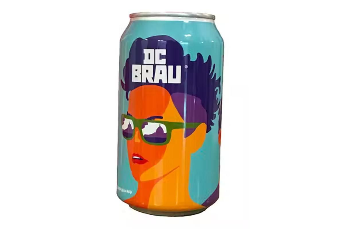 dc brau pride pilsner with a cartoon face on the can.