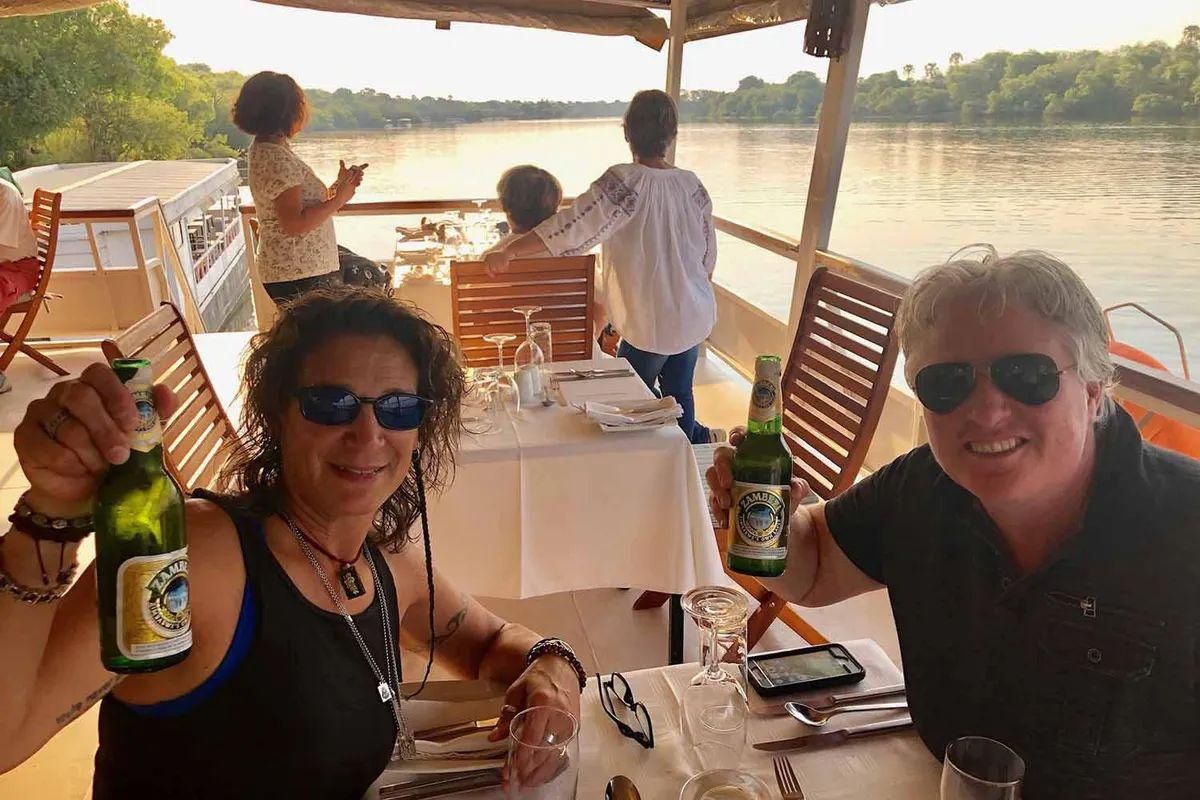 African Queens Travel founder Carla Smith and fiance Ramona Gatto on the Zambezi River in Victoria Falls, Zimbabwe.