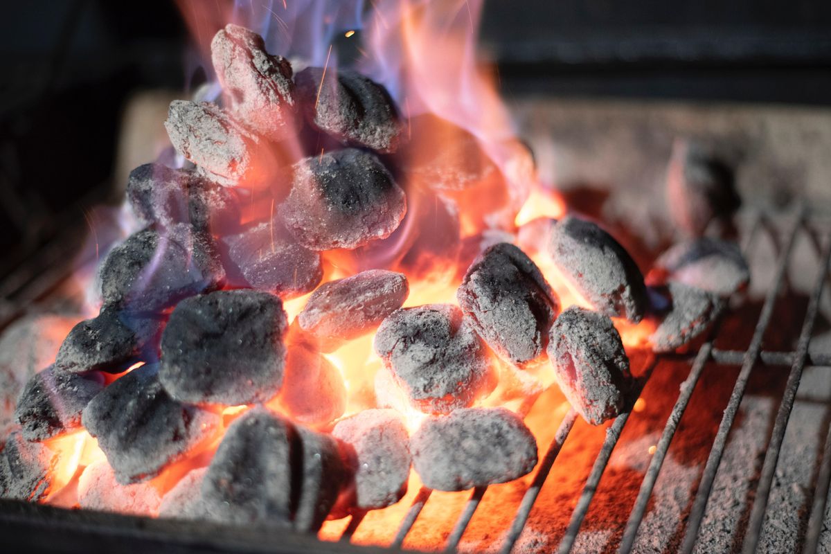 close up photo of a pile of charcoal on fire.
