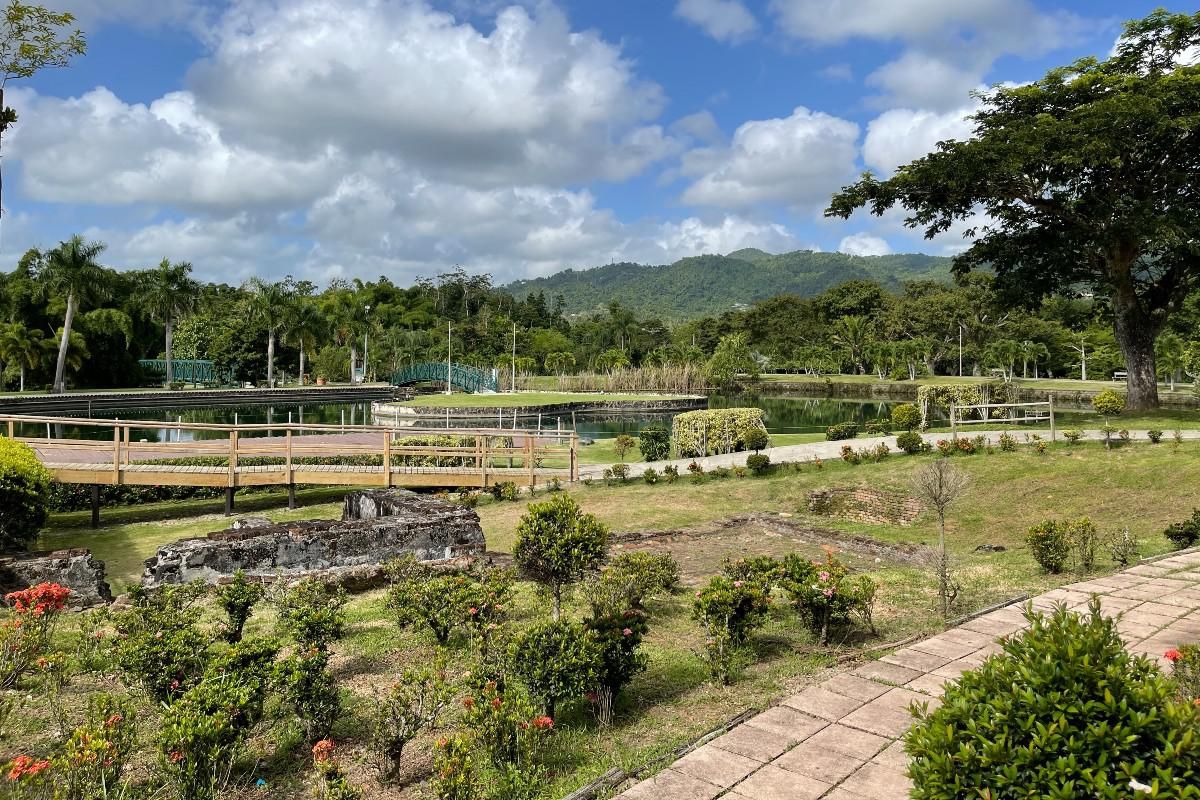 The William Miranda Mar\u00edn Botanical and Cultural Garden overlooking a large pond.