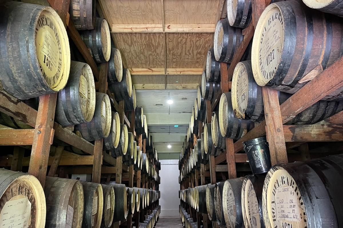 rows and rows of rum barrels in the aging process.