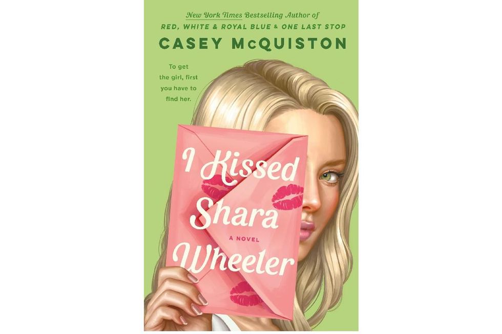 illustrated book cover of I Kissed Shara Wheeler with a woman holding a pink envelope in front of her face.
