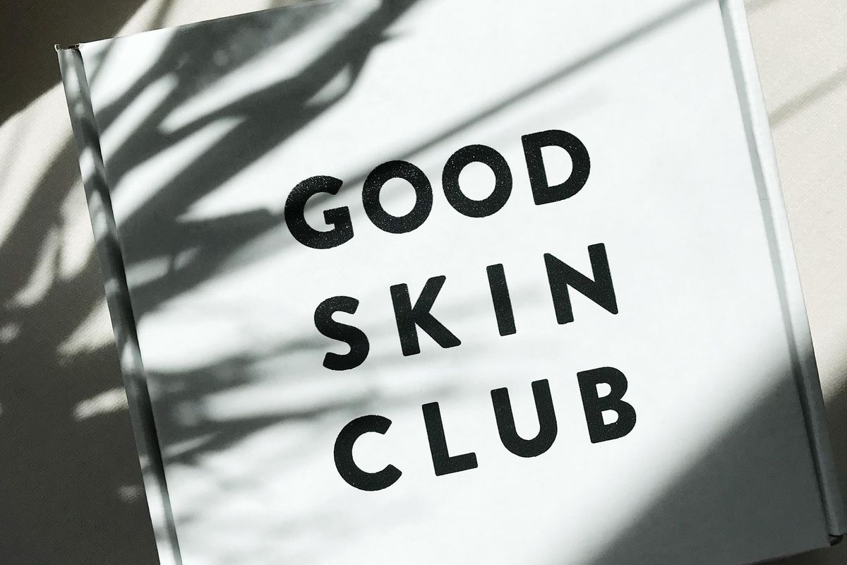 white box with the words good skin club printed on it.