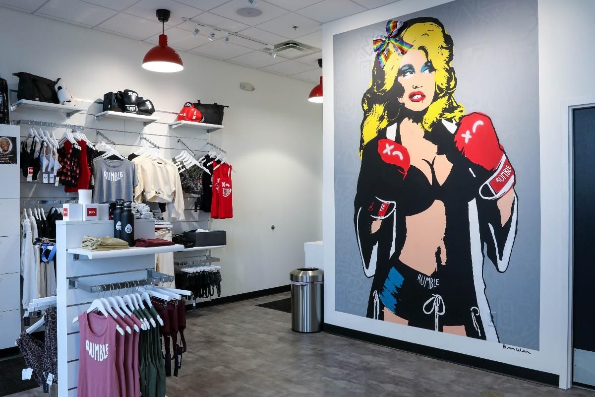 Rumble Boxing merchandise store with mural of Dolly Parton.