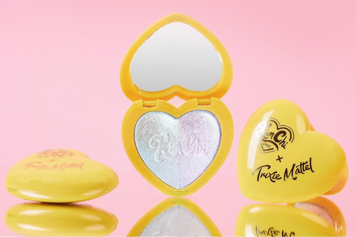 Makeup compact and mirror in the shape of a yellow heart.