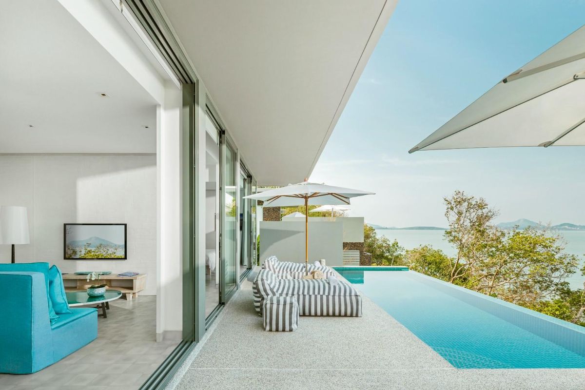 private villa with a view of the patio and infinity pool.