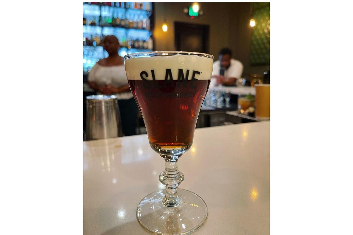 image of an Irish coffee with the words Slane Irish Whiskey on the glass.