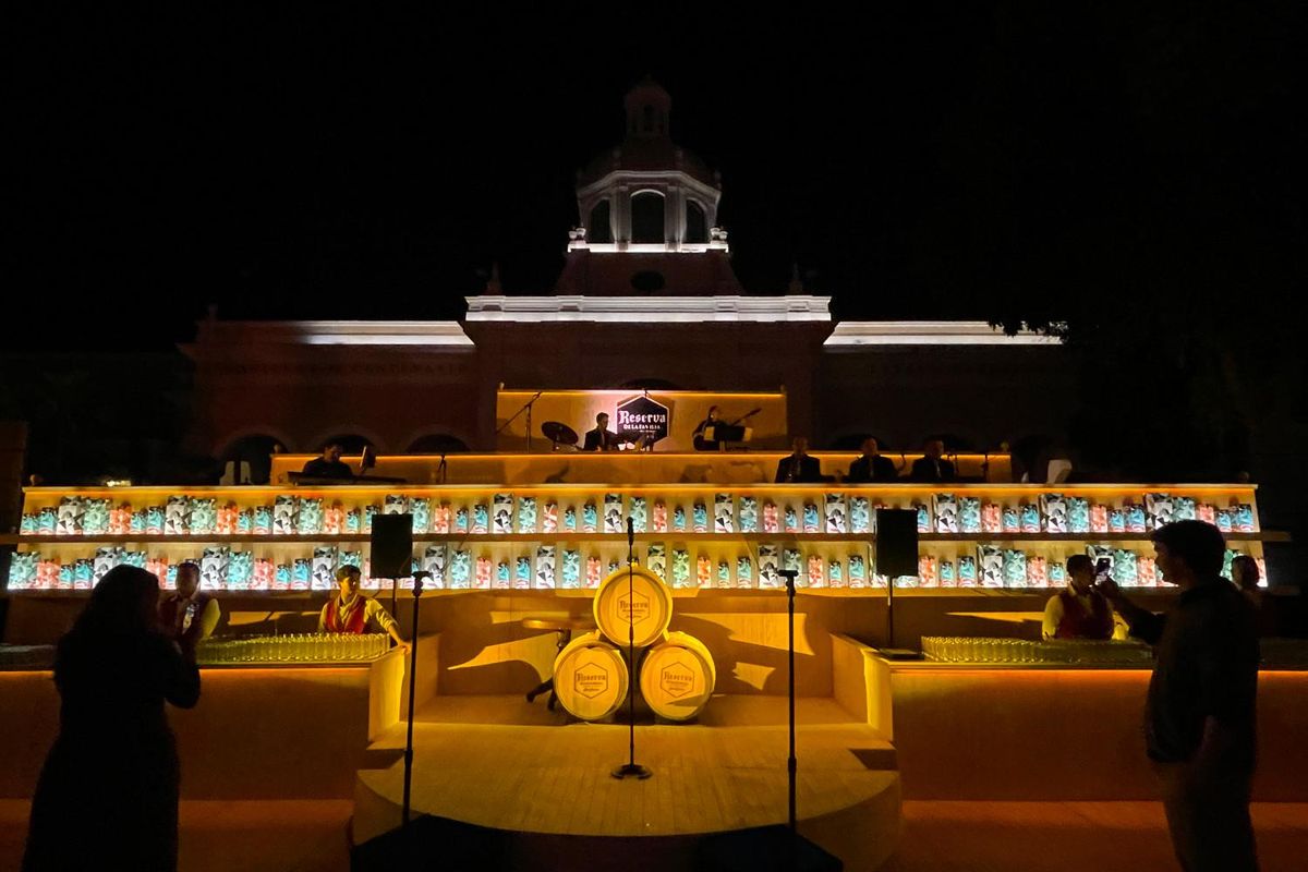 the bar, stage, and musician's platform at Hacienda el Centenario at night.