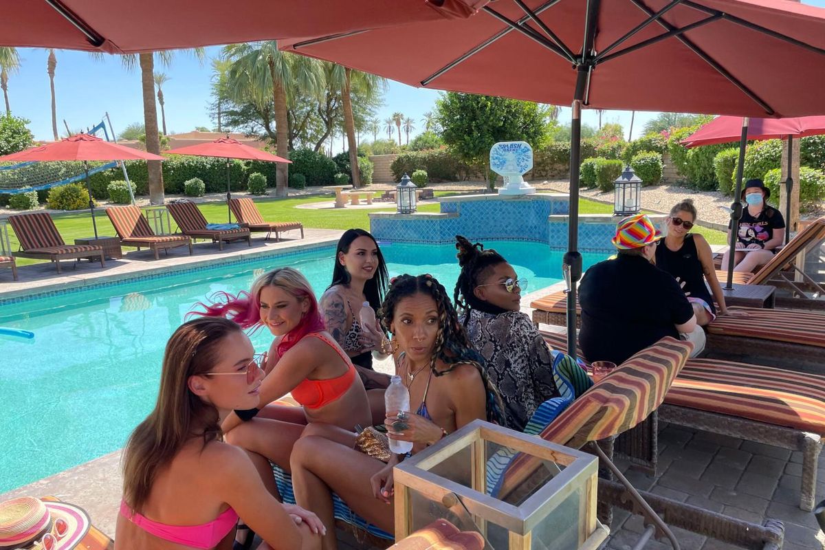 contestants of Coming Out for Love Dating Show sitting by the pool in Palm Springs.