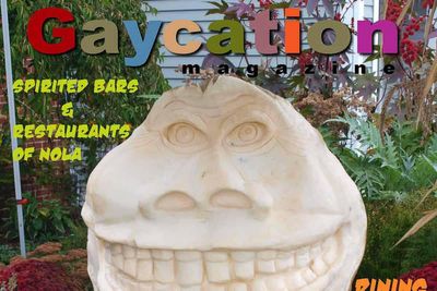 Halloween cover of gaycation magazine with a large carved pumpkin and fall backdrop in Ogunquit maine