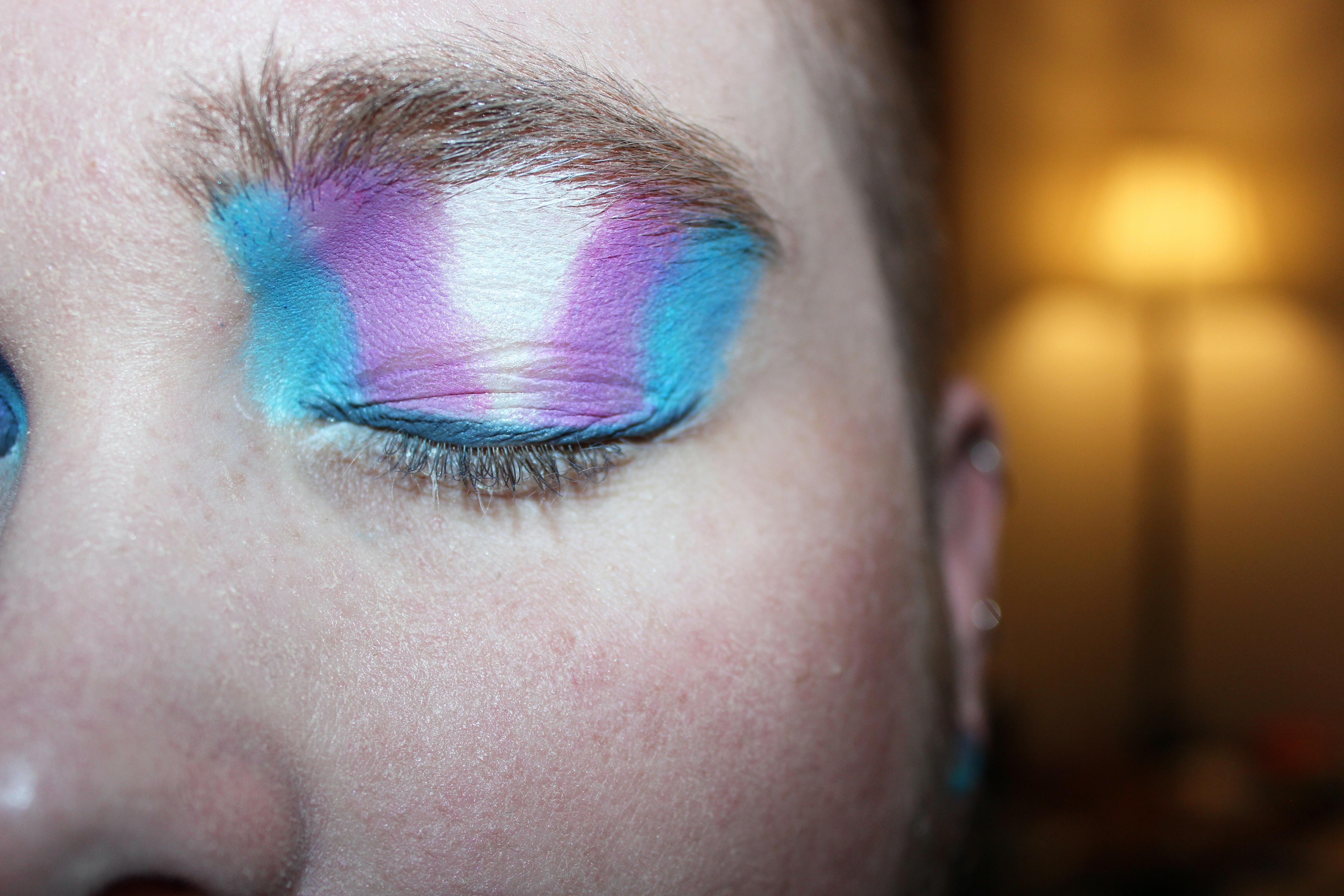blue purple white eyeshadow on young person's eye