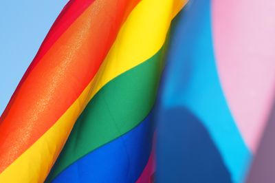 rainbow flag and transgender flag merging multicolors