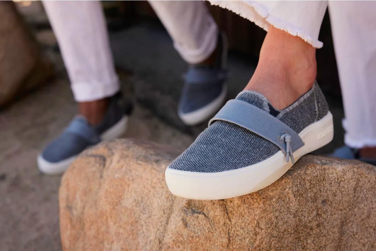 people wearing the BLUEVIEW Pacific shoe and their foot resting on a boulder.