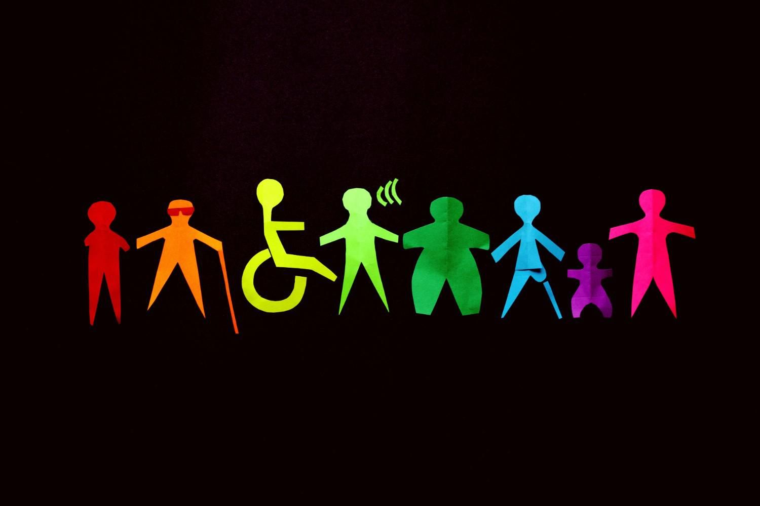 paper dolls of disabled people in colors of the rainbow.